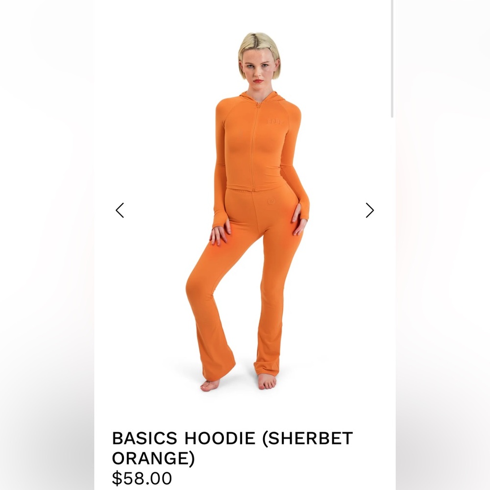 Body by Raven Tracy set in orange, M